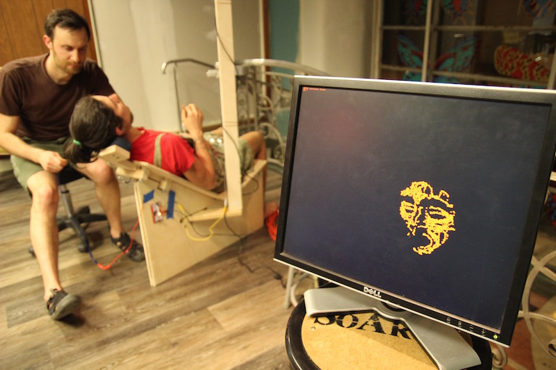 A remote screen displays the touch-map to onlookers